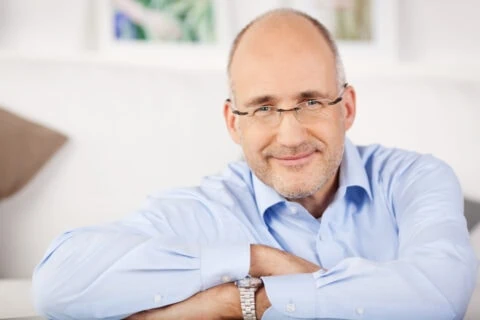 Close,portrait,of,smiling,man,relaxing,at,home
